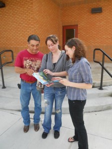 Members of the team enjoying a TLP-produced Tuncia children's book.